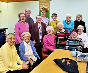 Knitted walking frame bags bring joy to care home residents