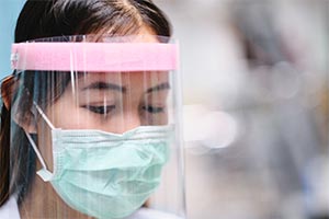 girl wearing PPE for COVID-19 antibody tests