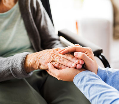 Hands of resident in social care