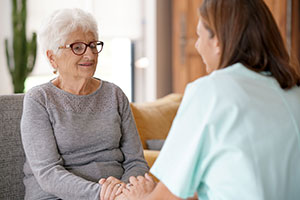 Care home worker with resident