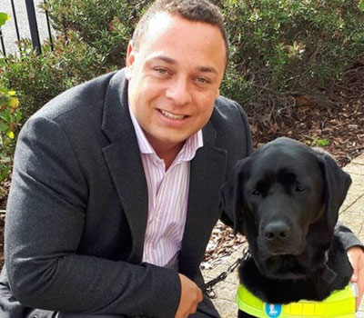 Daniel Williams with his guide dogs who helps him with his sight loss