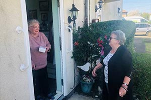 woman providing meals for vulnerable people