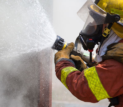 Firefighter tackling medical oxygen fires