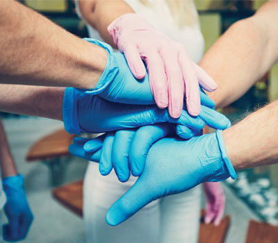 Group of people wearing JustGloves