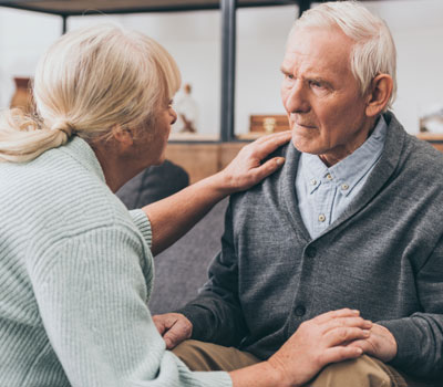 Old lady looking after man with dementia