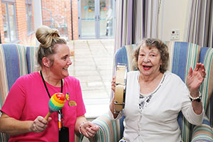 Laughing resident with good mental health in care home