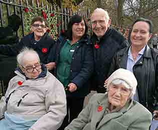 (back, from left) Mandale House Care Home carer Jackie Drinkel, resident Peter Wilson, domestic worker Lorrain Whitehead, resident May Small and (seated, from left) residents Irene Fleming and Billy James attend the Remembrance Day service at Thornaby War Memorial.