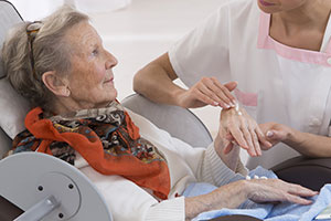 Resident from care home being kept hygienic by nurse