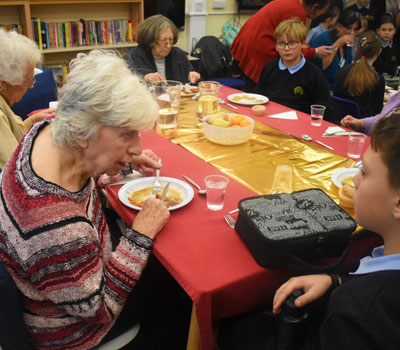 Stevenage nursing home residents at a primary school for lunch