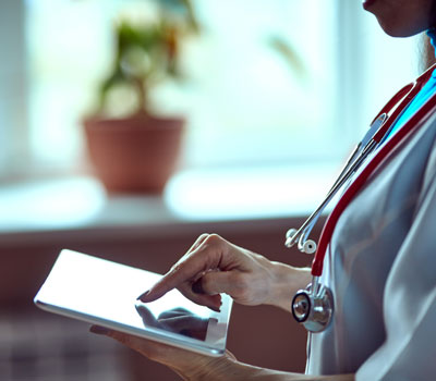 Woman doctor with tablet