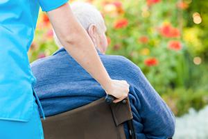 Raizer care home patient in wheelchair