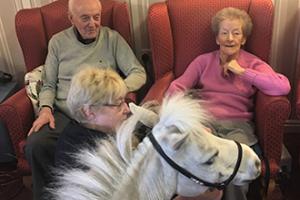 Blondie with 2 care home residents