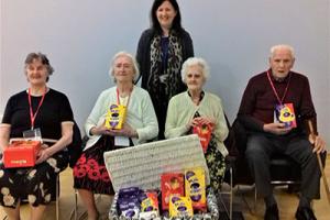 Elderly residents visiting a school to see Egg-cellent Easter display