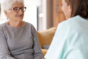 Care home worker with resident