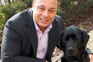 Daniel Williams with his guide dogs who helps him with his sight loss