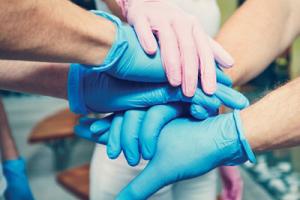 Group of people wearing JustGloves