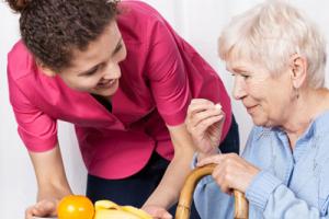 Care workers with a resident