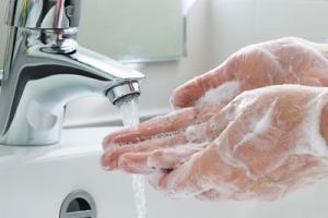 Nurse washing hands to prevent infection control