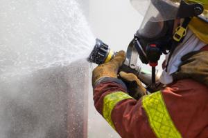 Firefighter tackling medical oxygen fires