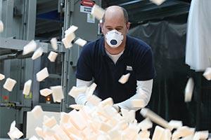 man making mattress to help supply NHS